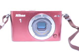Nikon 1 J3 camera with case and memory card