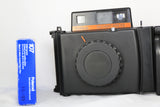 Konica Instant Press Film Camera w/ Hexanon 110mm f4 Lens w 107 B&W Film - EXC